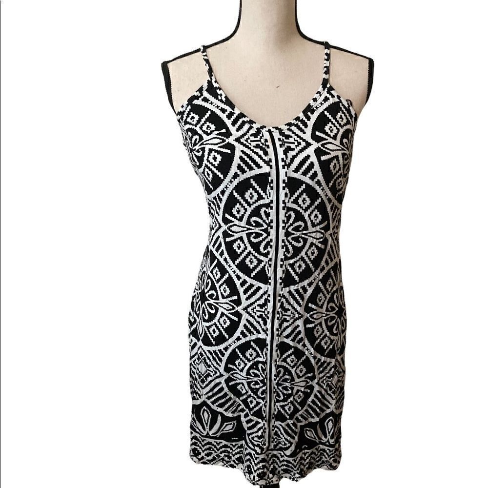 Figure hugging INC black and white dress, size M. Very small stain(see pic)